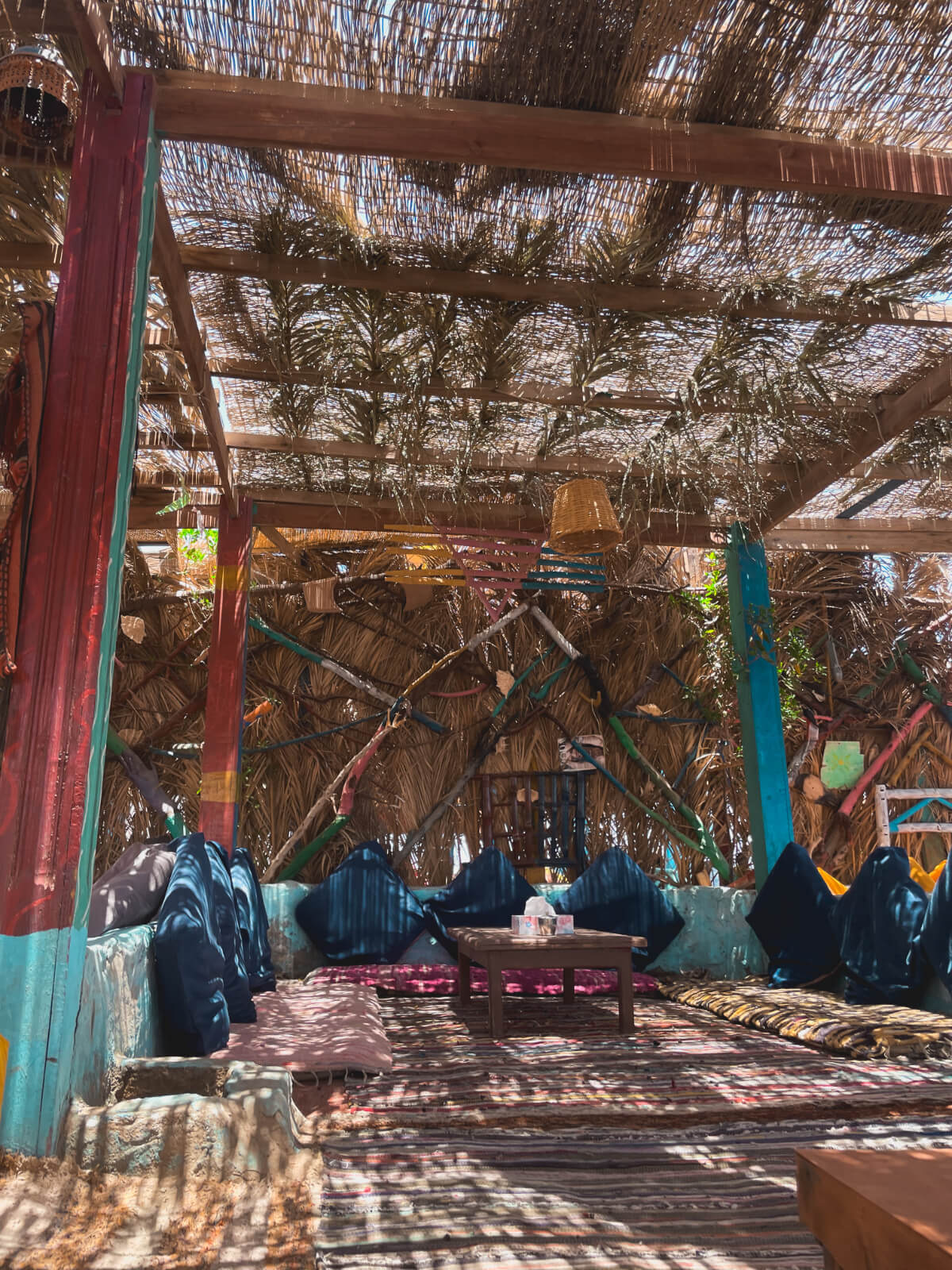 Seating area at Dahab's South, with a few cafes and multiple dive sites including 3 Pools