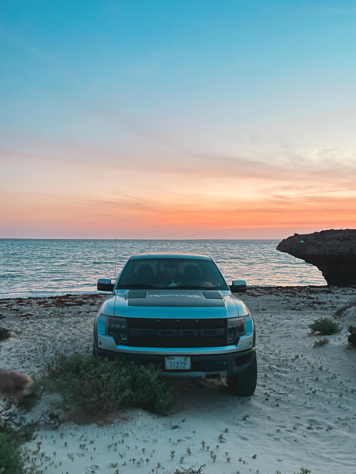 Our Ford Raptor parked on the beach at sunset in the Farasan Islands, Saudi Arabia