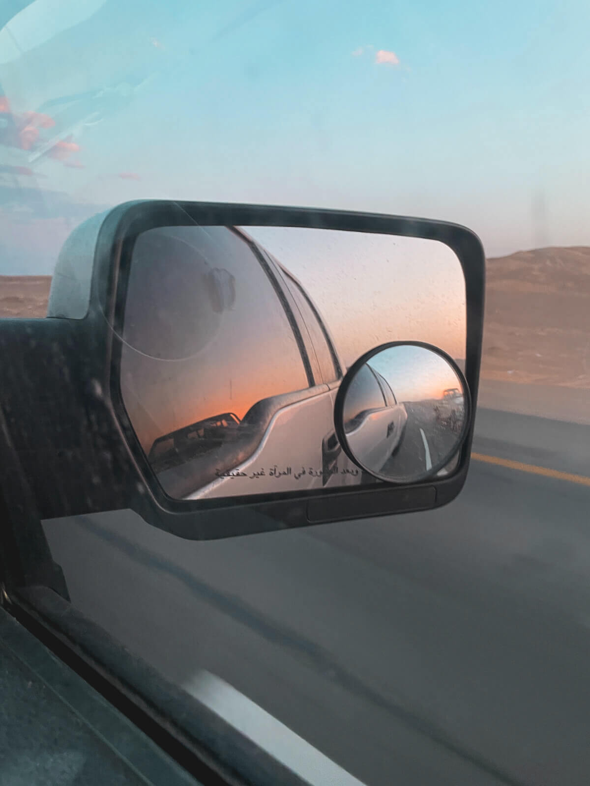 Sunset view from the side mirror of our Ford Raptor