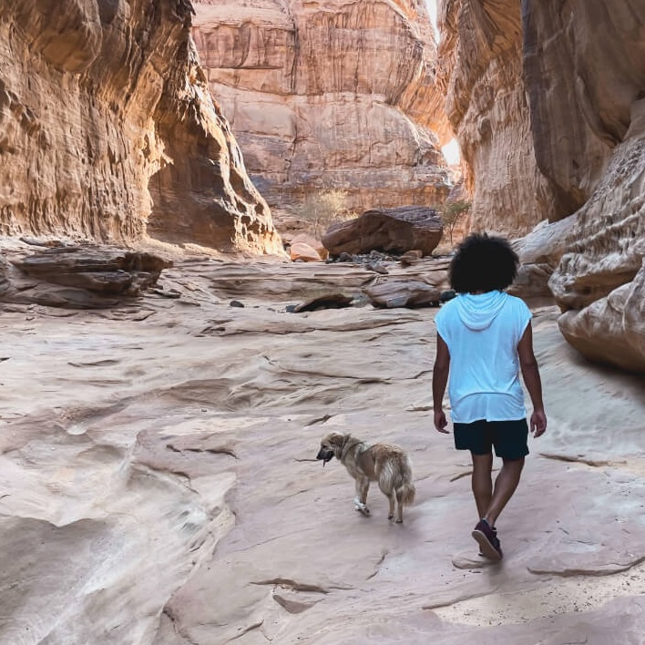 Mido and our dog, ZouZou, hiking in AlUla