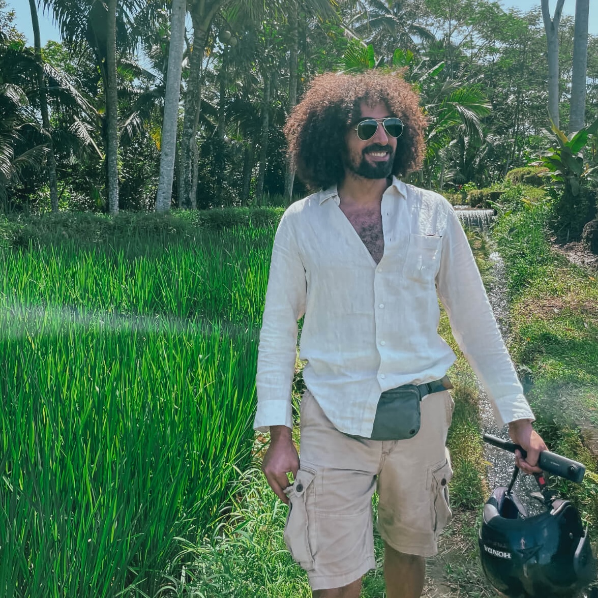 Mido walking through the rice fields of Bali